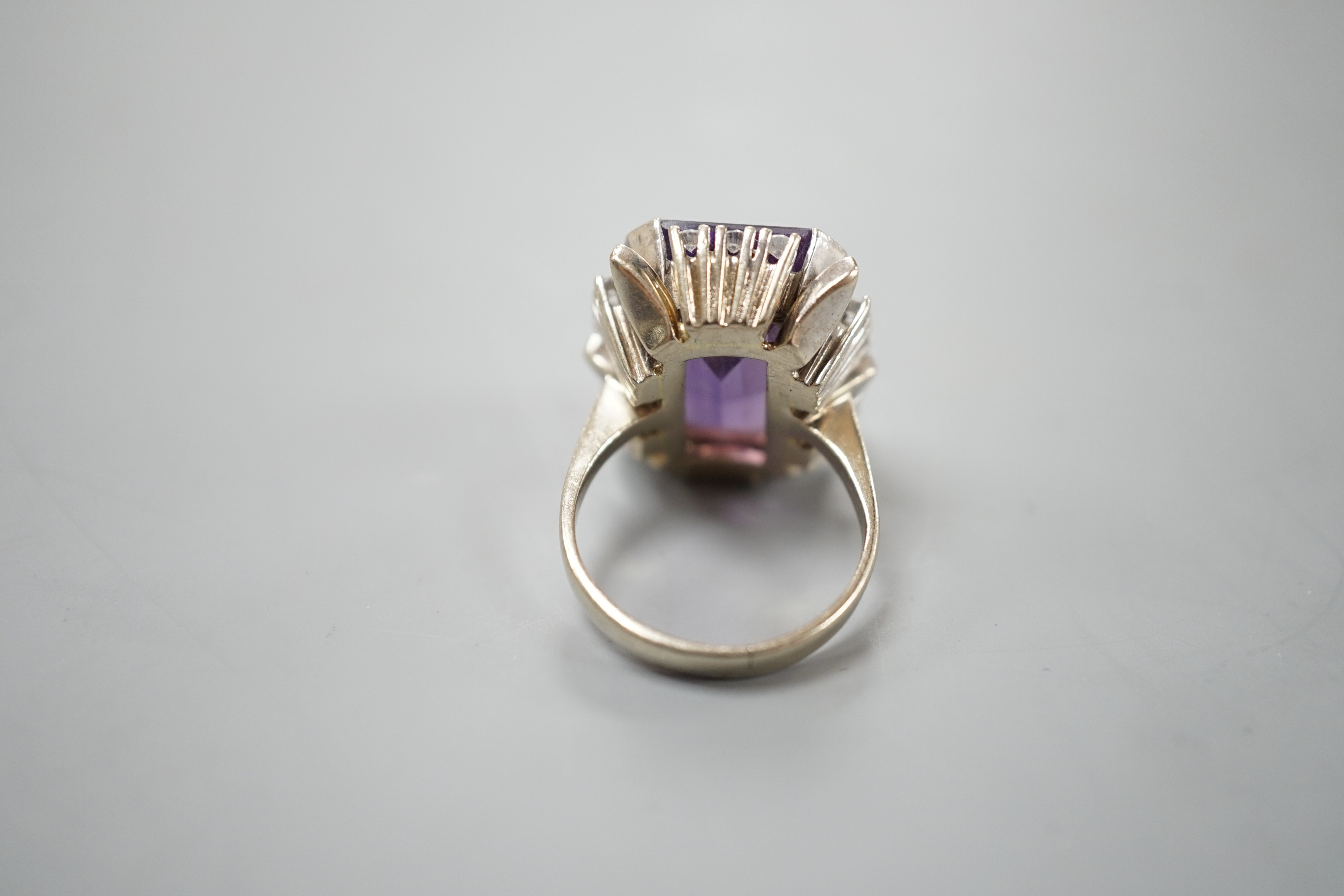 A 585 white metal emerald cut amethyst and diamond set cluster ring, size L, gross weight 11.5 grams.